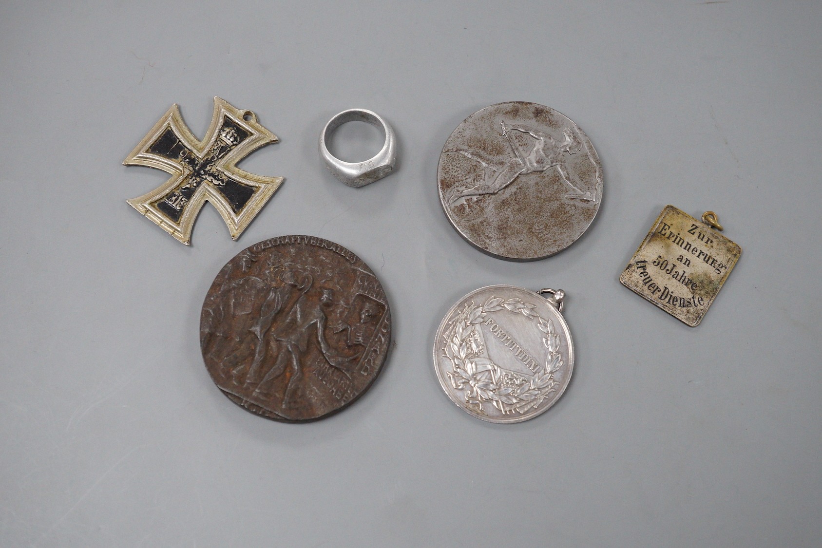 WWI German and Austrian medals, badges and objects, comprising a Zeppelin commemorative aluminium ring, engraved ‘ZEPP L31 OCT. 1916, made from the wreck of Zeppelin LZ31 which was destroyed on the 16th of September 1916